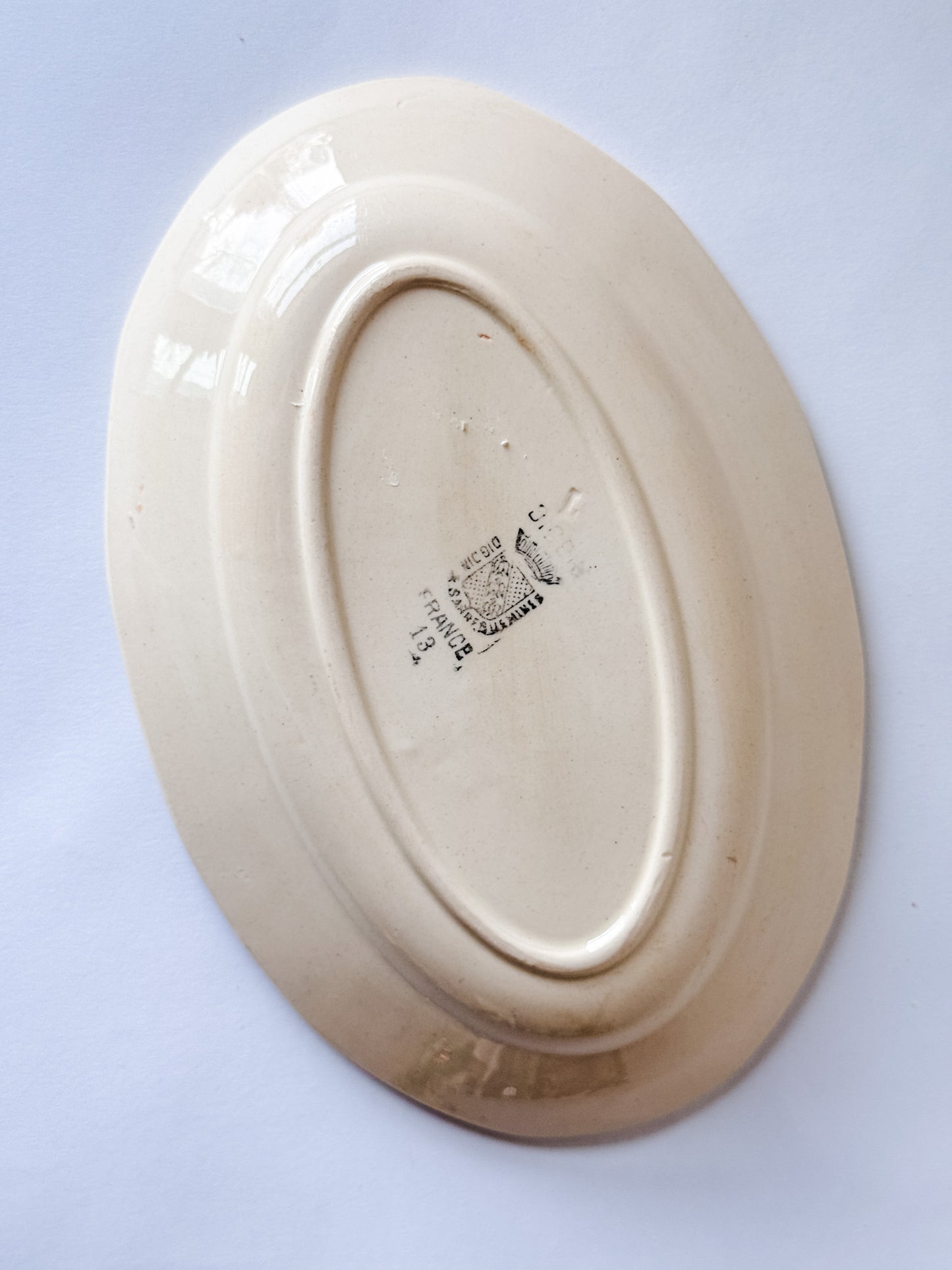 Small Appetizer Dish With a Blue Flower in the Middle