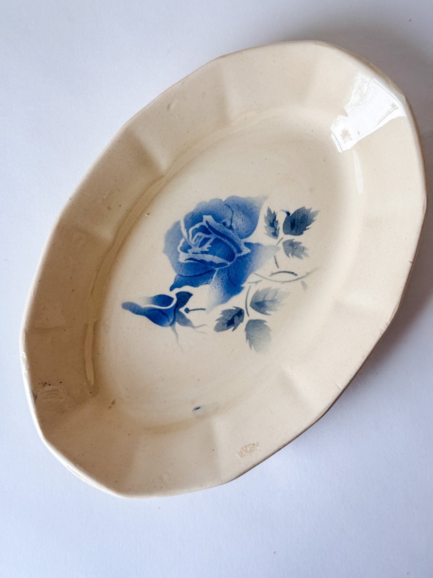 Small Appetizer Dish With a Blue Flower in the Middle